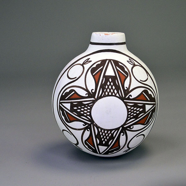 Vintage 1993 Canteen- Hand-painted Frog & Tadpoles by Esalio and Eustace; red/black slip, floral reverse, rounded base; approx. 5″ tall × 4.5″ wide. The floral motif side.