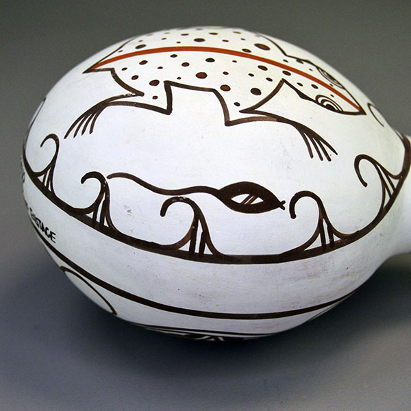 Vintage 1993 Canteen- Hand-painted Frog & Tadpoles by Esalio and Eustace; red/black slip, floral reverse, rounded base; approx. 5″ tall × 4.5″ wide. The side view of the tadpoles.