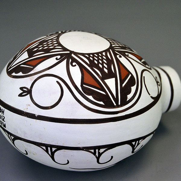 Vintage 1993 Canteen- Hand-painted Frog & Tadpoles by Esalio and Eustace; red/black slip, floral reverse, rounded base; approx. 5″ tall × 4.5″ wide. The other side view.