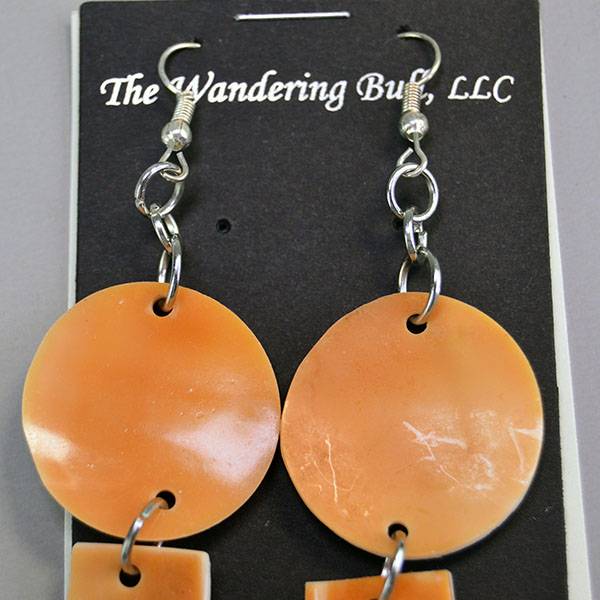 Orange Conch Shell double‑dangle earrings with drilled shell shapes, French hook ear wires, and handcrafted Wampanoag artistry by Devin Wixon. A closer view of the French hook ear wires.