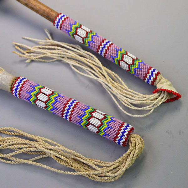 Handcrafted Gourd Dance Rattle Fan Set with bold beadwork, vibrant Macaw feathers, Ermine accents, and premium details for standout regalia.. Both the rattle and the fan have the same peyote stich pattern .