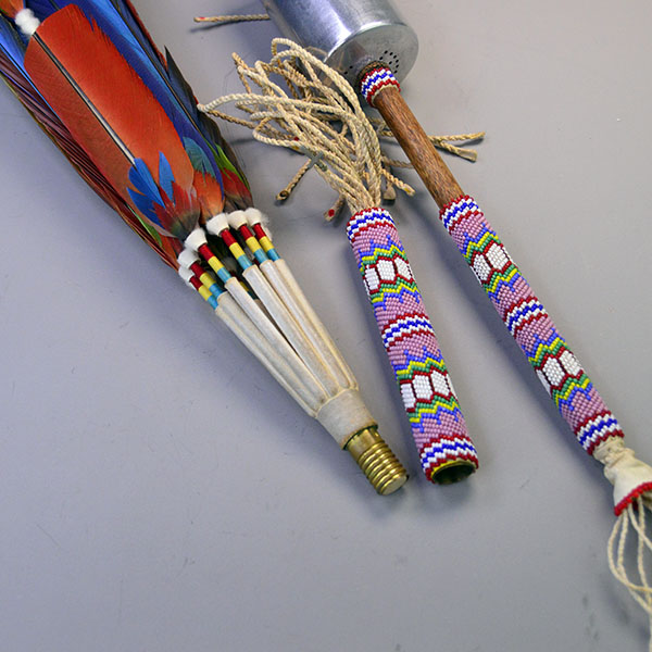 Handcrafted Gourd Dance Rattle Fan Set with bold beadwork, vibrant Macaw feathers, Ermine accents, and premium details for standout regalia.. The fan handle and the rattle handle are beaded the same.