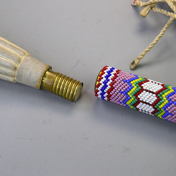 Handcrafted Gourd Dance Rattle Fan Set with bold beadwork, vibrant Macaw feathers, Ermine accents, and premium details for standout regalia.. Here is how the fan and the handle attach.