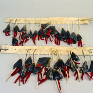 Handmade Deer Toe Leg Rattles on cream deerskin with red‑wool accents and traditional dance sound. They are approx. 14 inches long.  one of a kind.