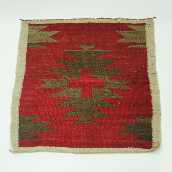 Handmade Navajo Rug Pair with Eye‑Dazzler and geometric designs in rich wool colors. The measurements for both are approx. 18" x 19" and 19.5" x 20". The geometric pattern rug.