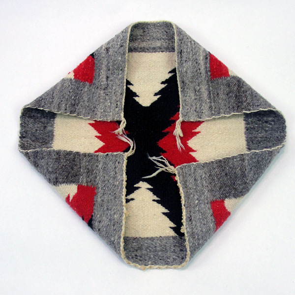 Handmade Navajo Rug Pair with Eye‑Dazzler and geometric designs in rich wool colors. The measurements for both are approx. 18" x 19" and 19.5" x 20". Showing the end of the rug.