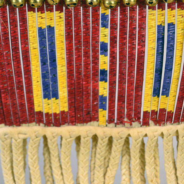 Pipe Bag- Double-sided Quillwork, Braintanned deerskin, braided fringe, cone‑drop tassels, and brass bells. Measures 45" with light age wear. The back of the quill wrapped strips.