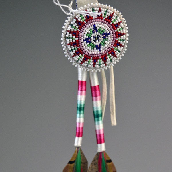 Scalp Feather- Pheasant Feathers with thread‑wrapped dividers, a 2" seed‑bead rosette, bright accent feathers, and a 14" overall length. Pictured here is the beaded rosette with the thread work. showing all the bright colors
