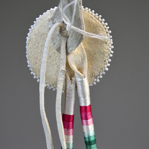 Scalp Feather- Pheasant Feathers with thread‑wrapped dividers, a 2" seed‑bead rosette, bright accent feathers, and a 14" overall length. pictured here is how the crafter attached the feathers to the rosette.