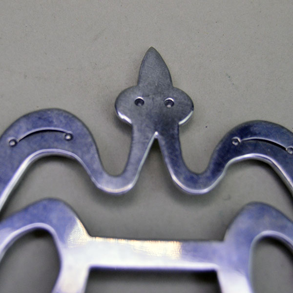 Make this stamped Scarf Slide- Waterbird one of your favorite accessories! This German Silver stamped scarf slide measures 3" x 3". one of a kind. The head of the waterbird.