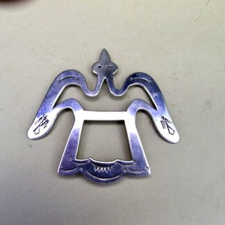 Make this stamped Scarf Slide- Waterbird one of your favorite accessories! This German Silver stamped scarf slide measures 3" x 3". one of a kind.