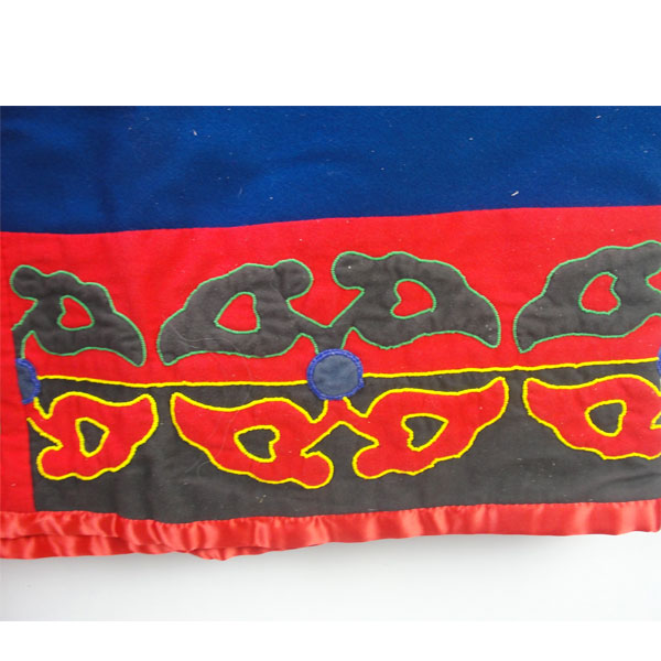 Skirt & Hood Set- Beaded Abstract floral motif, heavy wool, flannel lining, silk accents, bead outlines, approx. 30" × 45" for the skirt and 15" × 9" hood. Here is the bottom of the skirt showing the abstract floral design.