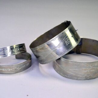 German Silver armband and cuff set with full hand‑stamped designs, maker’s marks “S” and “R,” plus NPW‑III‑1975 on cuffs. One of a Kind.