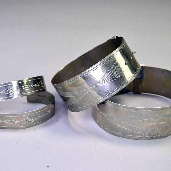 German Silver armband and cuff set with full hand‑stamped designs, maker’s marks “S” and “R,” plus NPW‑III‑1975 on cuffs. One of a Kind.