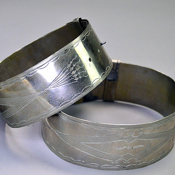 German Silver armband and cuff set with full hand‑stamped designs, maker’s marks “S” and “R,” plus NPW‑III‑1975 on cuffs. One of a Kind. Pictured here is the hand stamped design on the arm bands.