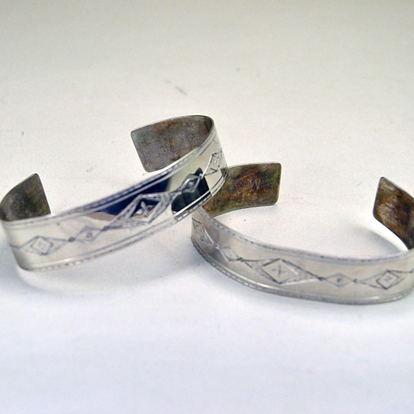 German Silver armband and cuff set with full hand‑stamped designs, maker’s marks “S” and “R,” plus NPW‑III‑1975 on cuffs. One of a Kind. Pictured here is the cuffs and showing the beautiful hand stamped design.