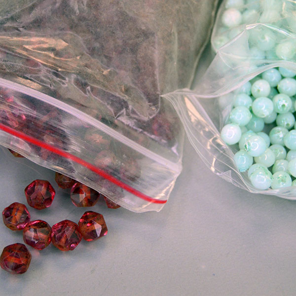 38‑oz Bead Lot- Assorted Glass Beads mix featuring heart, diamond, round, and teardrop shapes—perfect for jewelry and craft projects. one of a Kind. Pictured here are the diamond shape and round.