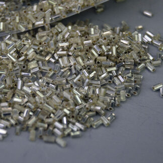 Bead Lot- Clear Silver Lined in a 17‑oz lot. Sized 3×1.98mm, perfect for detailed beadwork, shimmering fringe, and dimensional jewelry designs.