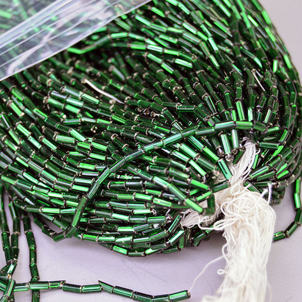 Bead Lot- Silver Lined Bugle dark green in a 17‑oz lot. Sized 4x2mm, perfect for detailed beadwork, bold fringe, and richly textured designs. limited stock