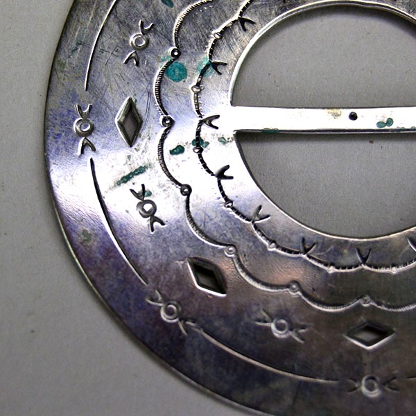 Scarf Slide- 2.5" Circular with hand‑stamped scallops and diamond cutouts. Smooth angled opening for easy glide; perfect for regalia and neckwear. Here is a close up of the diamond cut outs and the different hand stamped designs.