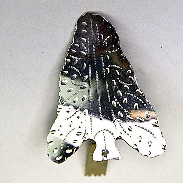 German silver Scarf Slide- Arrowhead with stamped designs and rectangular drop. Handmade piece in very good condition, measuring 4″ by 2.25″.