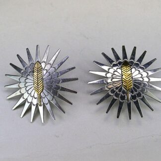 Pair Scarf Slide- Brass Feather hand‑stamped on German silver stars. Measures 2″ x 2″. Bold, compact accents for regalia, bandanas, and neckerchiefs.