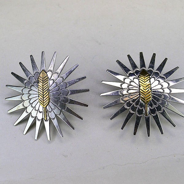 Pair Scarf Slide- Brass Feather hand‑stamped on German silver stars. Measures 2″ x 2″. Bold, compact accents for regalia, bandanas, and neckerchiefs.