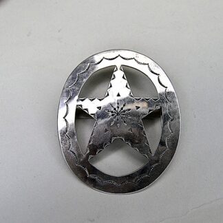German silver Scarf Slide- Oval with Star with hand‑stamped designs and star cutout. Smooth loop for easy glide. Approx. 3" in diameter.