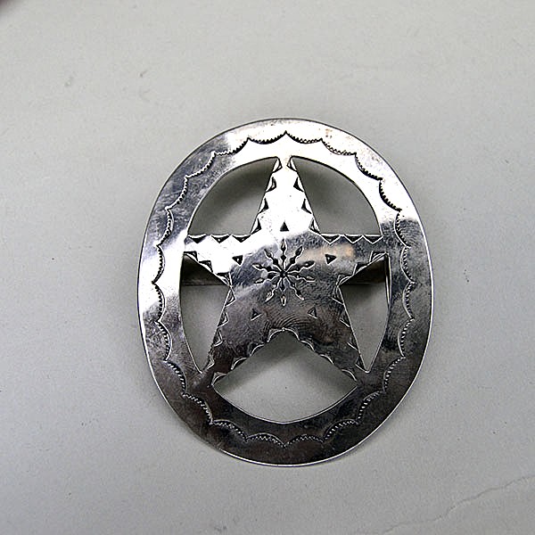 German silver Scarf Slide- Oval with Star with hand‑stamped designs and star cutout. Smooth loop for easy glide. Approx. 3" in diameter.