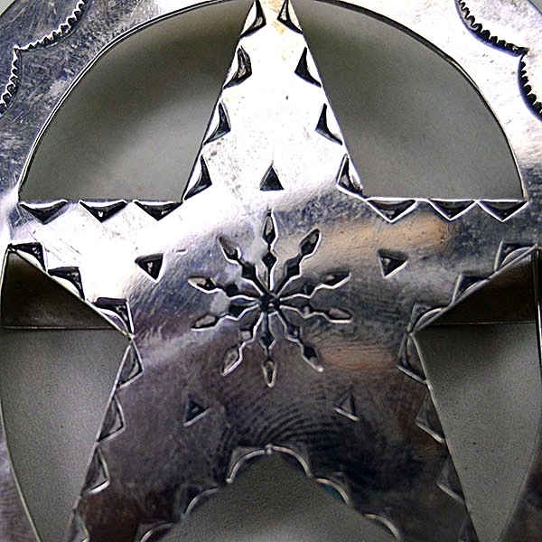 German silver Scarf Slide- Oval with Star with hand‑stamped designs and star cutout. Smooth loop for easy glide. Approx. 3" in diameter. Pictured here is a close up of the hand stamped design.