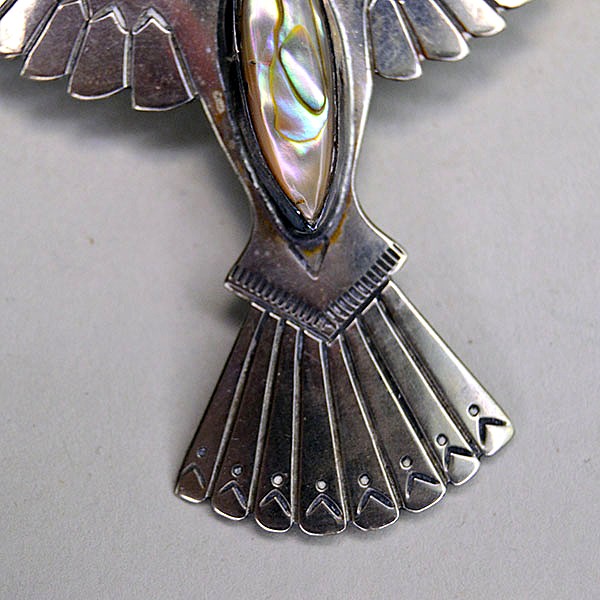 German silver Scarf Slide- Waterbird Abalone Gem, stamped, RI on the back and sized 3.5″ × 2.5″. Great for securing scarves, bandanas, or neckerchiefs. pictured here is the bottom of the waterbird showing the stamped design on the feathers.