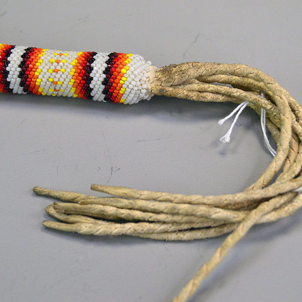 Fan Macaw Beaded Handle bottom handle and twisted fringe