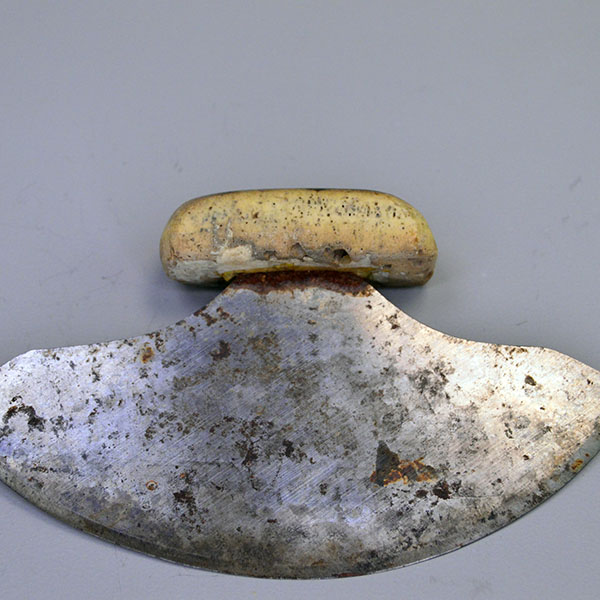 Vintage Knife- Vintage ULU with a 6" crescent blade and carved bone handle (2.25" x 1"), offering authentic traditional craftsmanship for collectors.