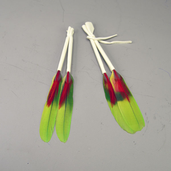Scalp Feather- Macaw Pair with red and orange accents and leather wraps. Adds vivid color and movement to regalia. 7–7.5″ finished length. One of a Kind