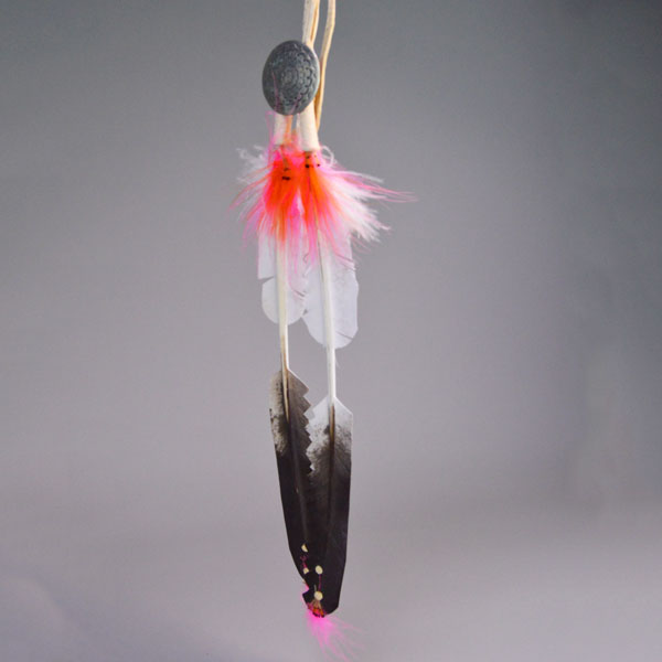 Scalp Feather- Stamped Concho, Hand‑painted scalp feather with a stamped concho, cut designs, pink fluffs, and traditional detailing. Measures 12.5 inches.