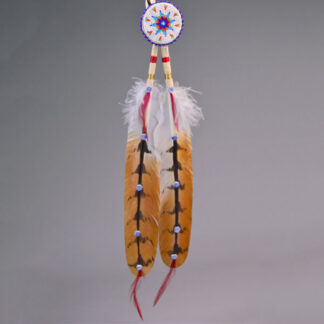 Hand‑painted turkey scalp feathers with a vibrant 11/0 beaded rosette, red accent tip, and deerskin wrapping for a balanced, traditional regalia finish.