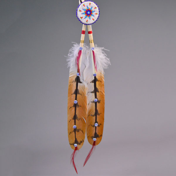 Hand‑painted turkey scalp feathers with a vibrant 11/0 beaded rosette, red accent tip, and deerskin wrapping for a balanced, traditional regalia finish.