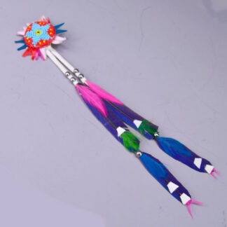 Scalp feathers with blue macaw feathers, blue and green accent feathers an metal spots. Topped with beaded rosette.