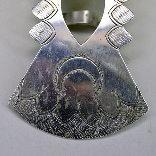 German silver Scarf Slide- Cross & Moon and heart cutout, finished with stamped designs and maker’s mark RR. Measures 3 inches by .75 inches. Pictured here is the hand-stamped moon and the design around it.