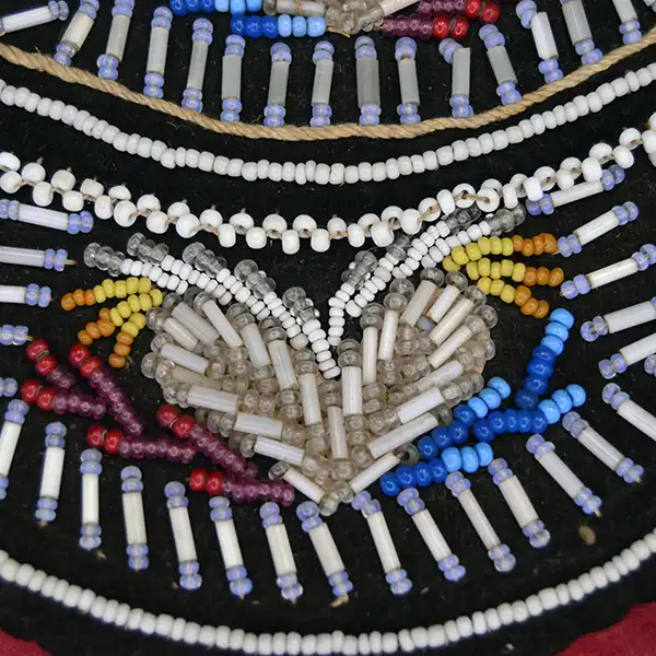 Antique Bag- Beaded Iroquois Style velvet bag with heart designs, pony‑bead edging, and worn bias tape. Approx. 5.25″ × 5.75″. One of a Kind. The beaded heart design.