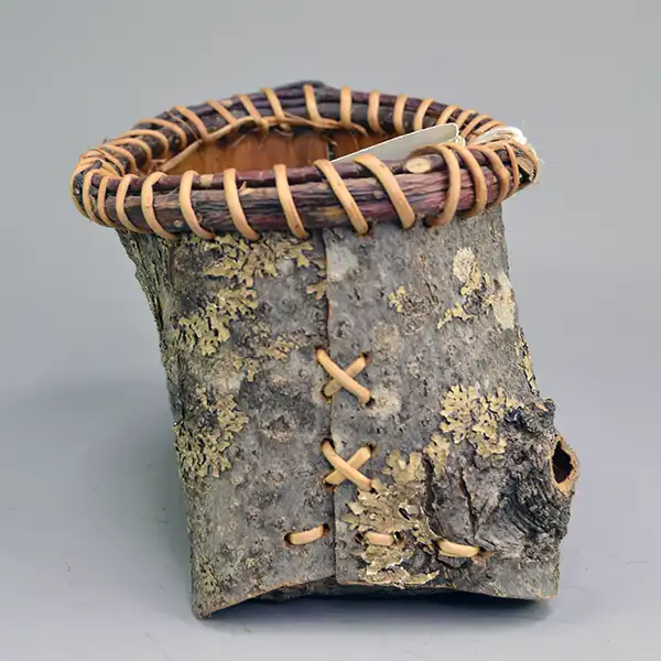 Basket- Ash Bark with spruce‑root stitching and Jennifer Lee’s signature—perfect for your collection. Approx. 7.5″ by 4.5″ One of a Kind. One side.