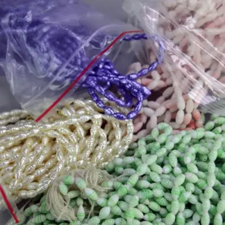 Bulk 34 oz Bead Lot- Oval Shaped Glass featuring purple, pink, cream, and light green beads. Ideal for jewelry design, crafting, and decorative beadwork.