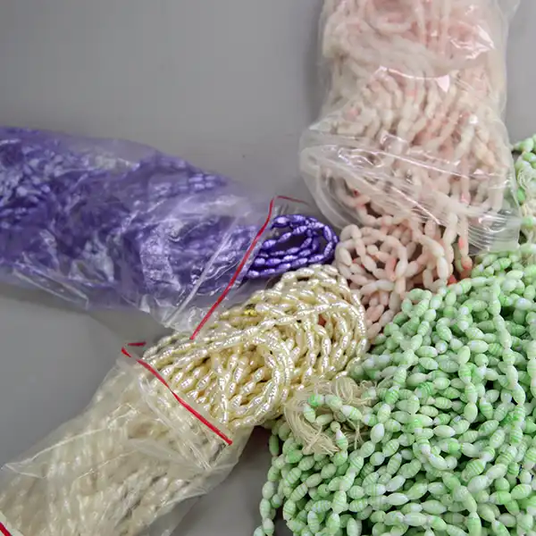 Bulk 34 oz Bead Lot- Oval Shaped Glass featuring purple, pink, cream, and light green beads. Ideal for jewelry design, crafting, and decorative beadwork. Here is a larger area showing the colors.