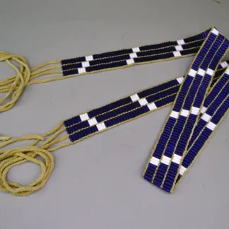Belt- Wampum 3 Row made with white and transparent blue glass beads and smoked deerskin lacing. Measures 42" long with 15" fringe.