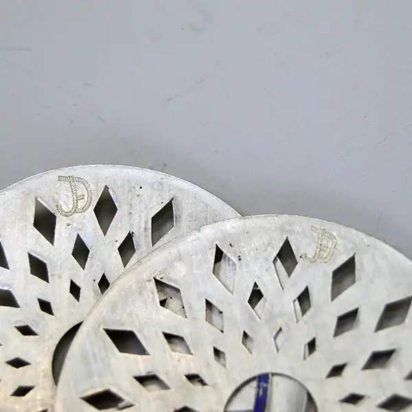 German silver Brooch- 3 Piece Set with matching cut‑out designs. Each brooch measures 3". A unified, artisan‑crafted collection for wear or display. Pictured here is the makers mark on the two.