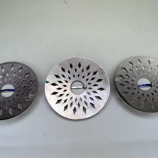 German silver Brooch- 3 Piece Set with matching cut‑out designs. Each brooch measures 3". A unified, artisan‑crafted collection for wear or display. Pictured here is the backs.