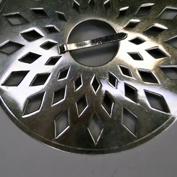 German silver Brooch- 3 Piece Set with matching cut‑out designs. Each brooch measures 3". A unified, artisan‑crafted collection for wear or display. pictured here is a close up of the cutout design.