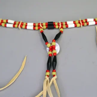 Choker- Greasy Yellow & Red this two-row choker features buffalo hairpipe, bone tube beads, shell conchos, and vibrant red and yellow beadwork. The back view.