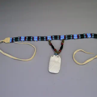 Choker- Two Row by Andy Bullock with buffalo tubes, hairpipe, crow beads, and etched bone pendant. Approx. 14.5″ with 5″ drop. One of a Kind.