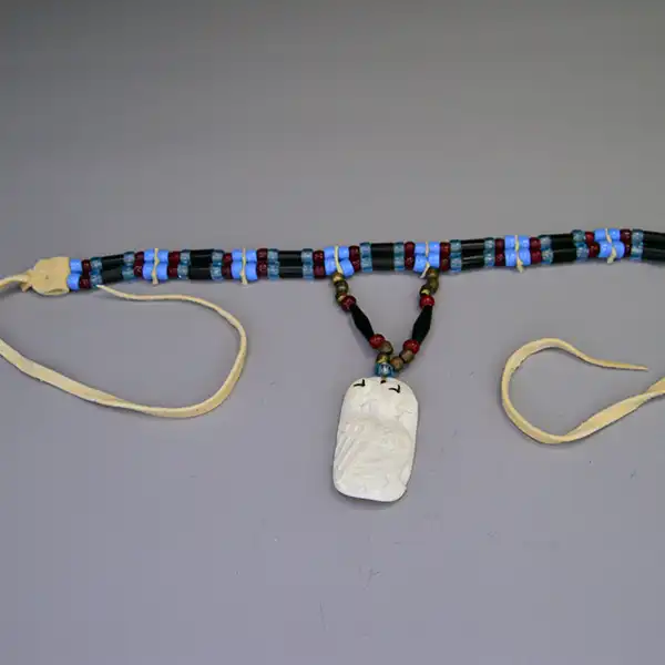Choker- Two Row by Andy Bullock with buffalo tubes, hairpipe, crow beads, and etched bone pendant. Approx. 14.5″ with 5″ drop. One of a Kind.